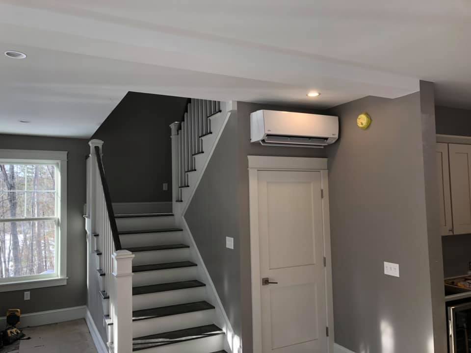 Wall-mount Heat Pump near staircase